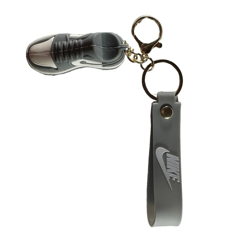Grey & white miniature Nike Keychain styled like an Air Jordan wrist strap/bag